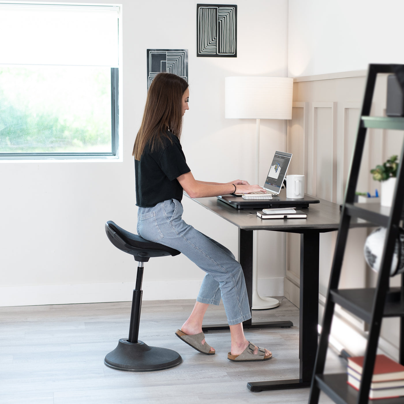 A desk riser you can work from while sitting or standing.