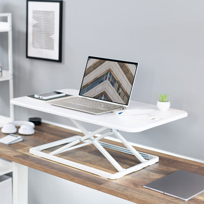 Heavy-duty height adjustable desk converter monitor riser.