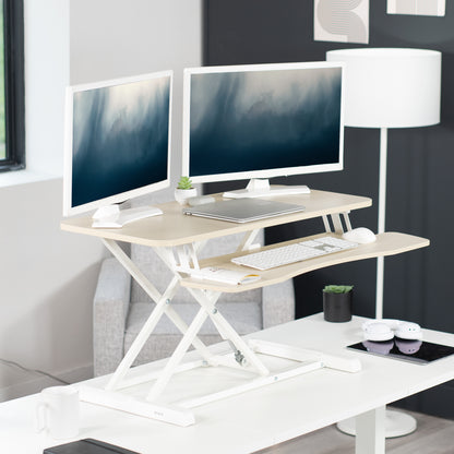 Sturdy height adjustable 2-tiered desk riser for ergonomic office workstation.