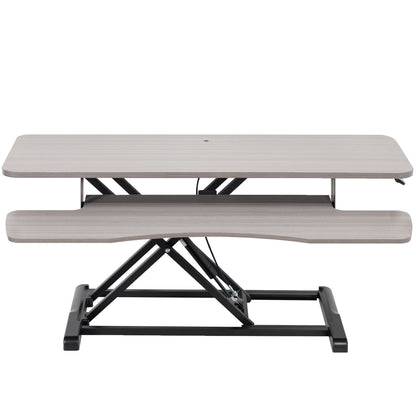 Sturdy height adjustable 2-tiered desk riser for ergonomic office workstation.