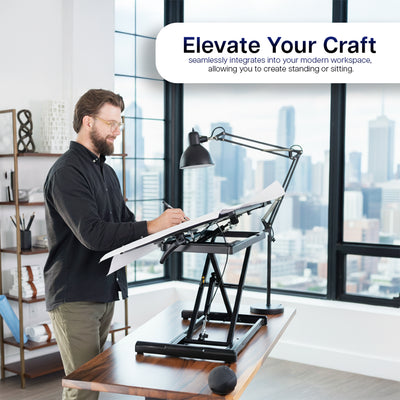 Person working on an adjustable tilting desk in a modern, office space