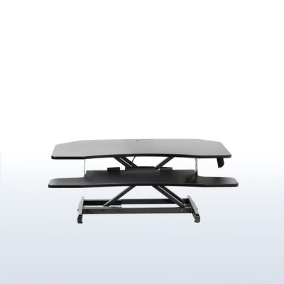 Heavy-duty height adjustable desk converter monitor riser for corner desk workstation.