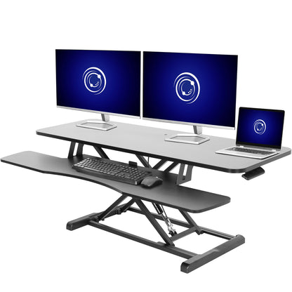 Sturdy height adjustable 2-tiered desk riser for ergonomic office workstation.