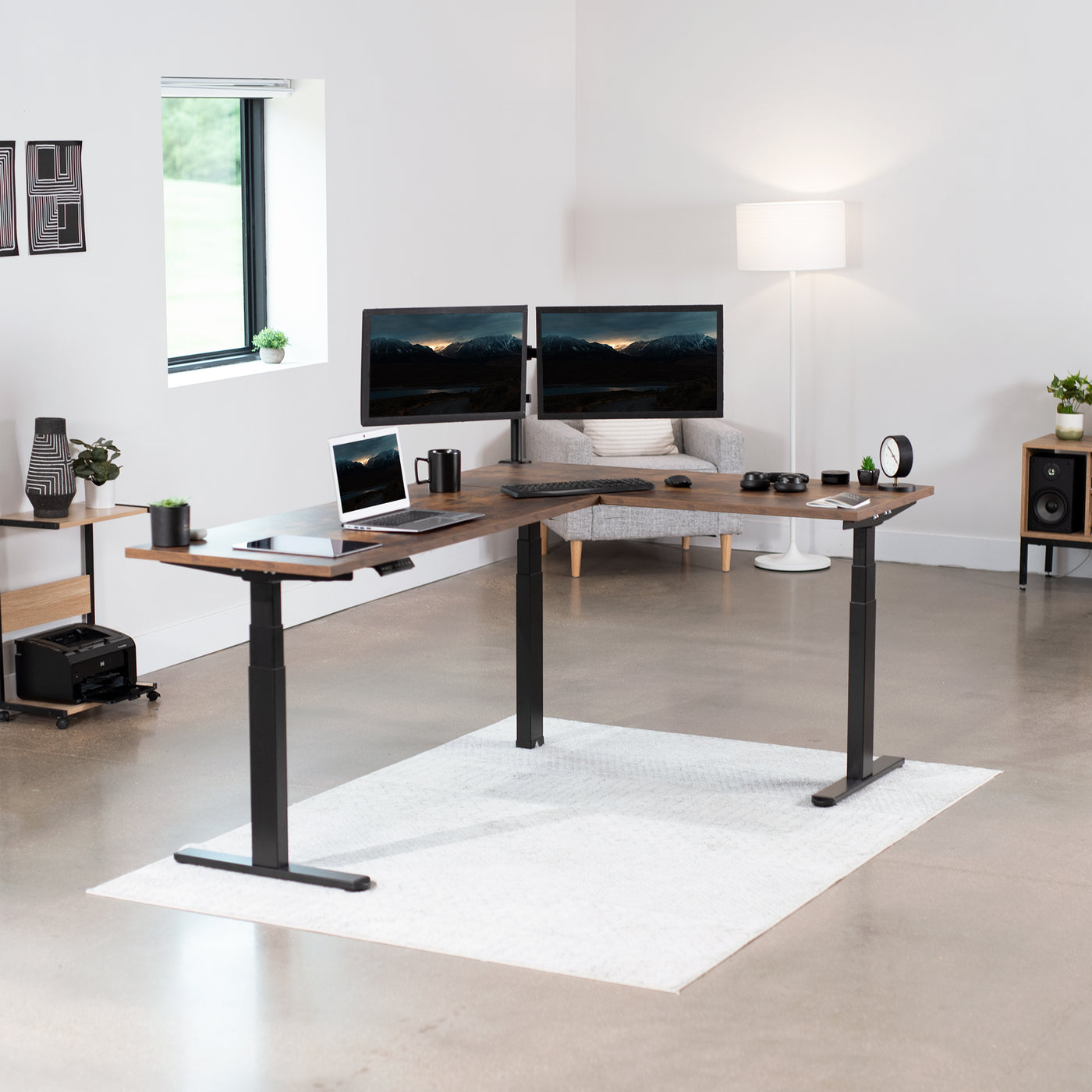 Large L-shaped desk in a modern minimalist room.