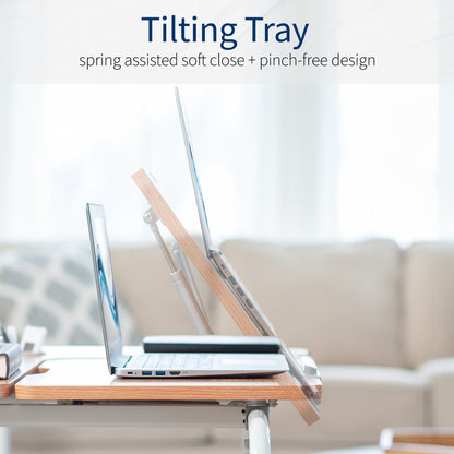 Tilting tray with spring assisted soft close and pinch-free design.