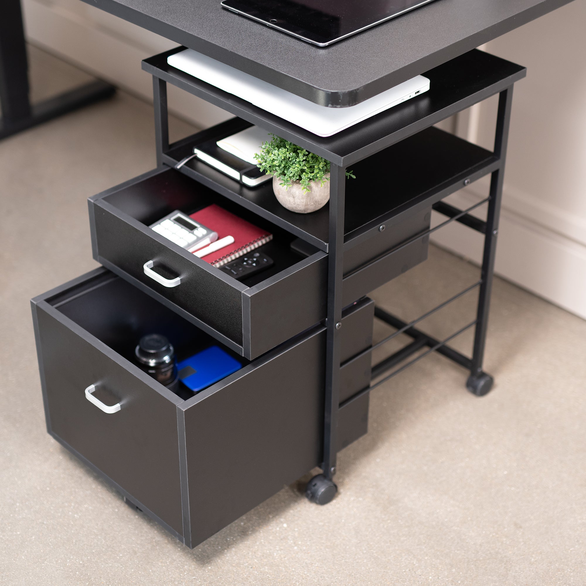 Heavy duty mobile filing cabinet with locking casters and anti-tip wheel.