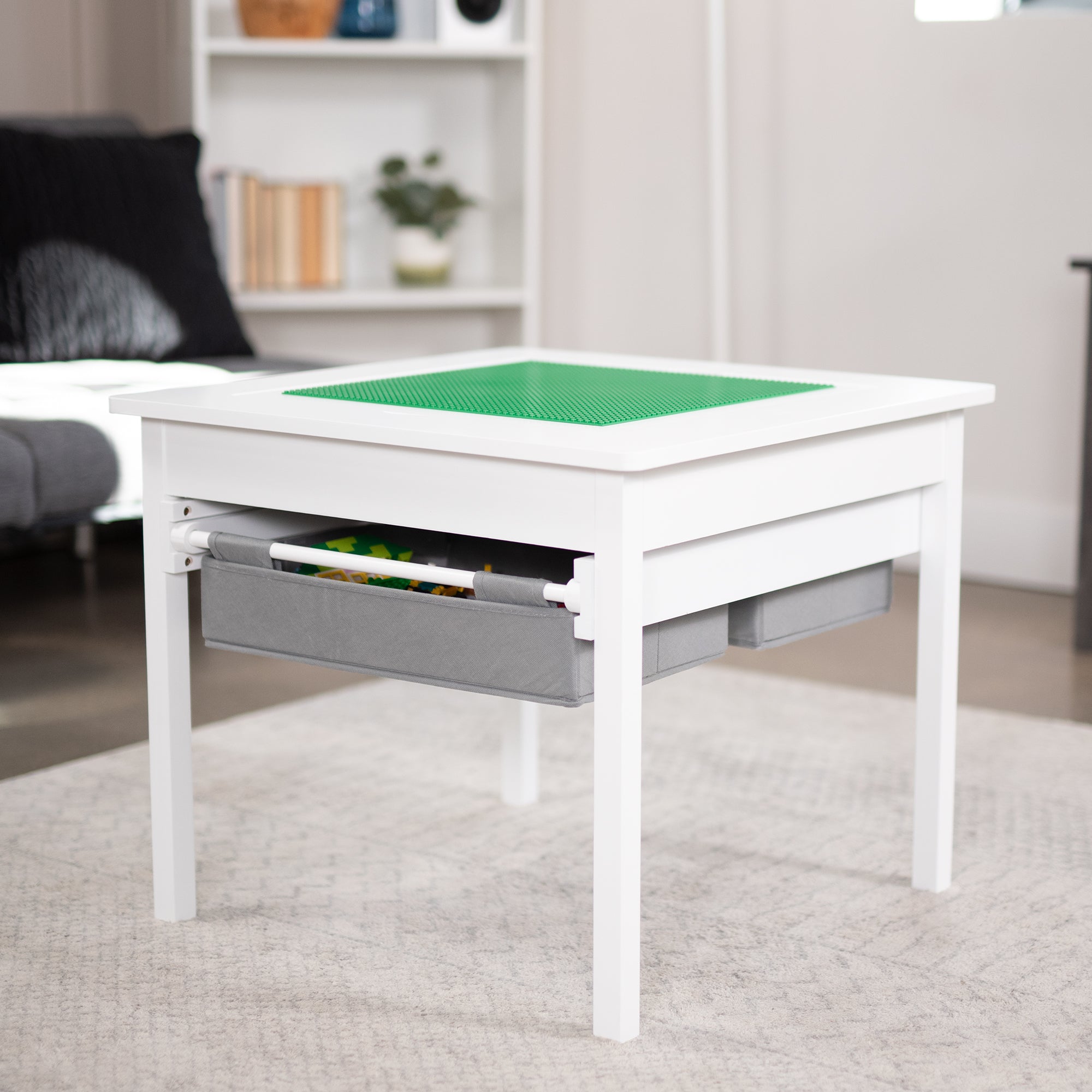 Kids' play table for Lego building bricks with reversible building base top and two pull-out drawers.