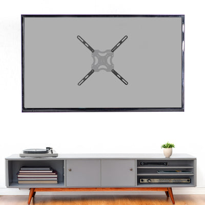 Large flat-screen TV on a white wall above a gray entertainment console with wooden legs.