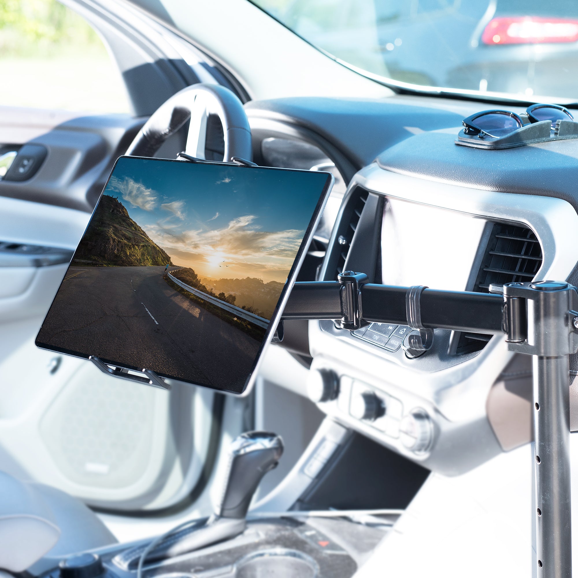 Perfect for on-the-go use, this car tablet stand anchors to the seat bolts on the passenger side chair, providing a secure and sturdy workstation.