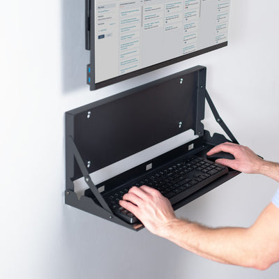 Wall-mounted flip down keyboard tray platform. Low profile design folds up and out of the way when not in use. Velcro included to keep keyboard in place. Fits a standard-sized keyboard and mouse (mouse pad included). Mount to drywall, wood studs, brick, or concrete.