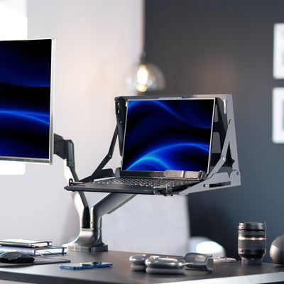 Laptop Sitting in Black VIVO VESA Flip Down Mount on Desk