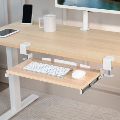 Compact clamp-on pullout keyboard tray.