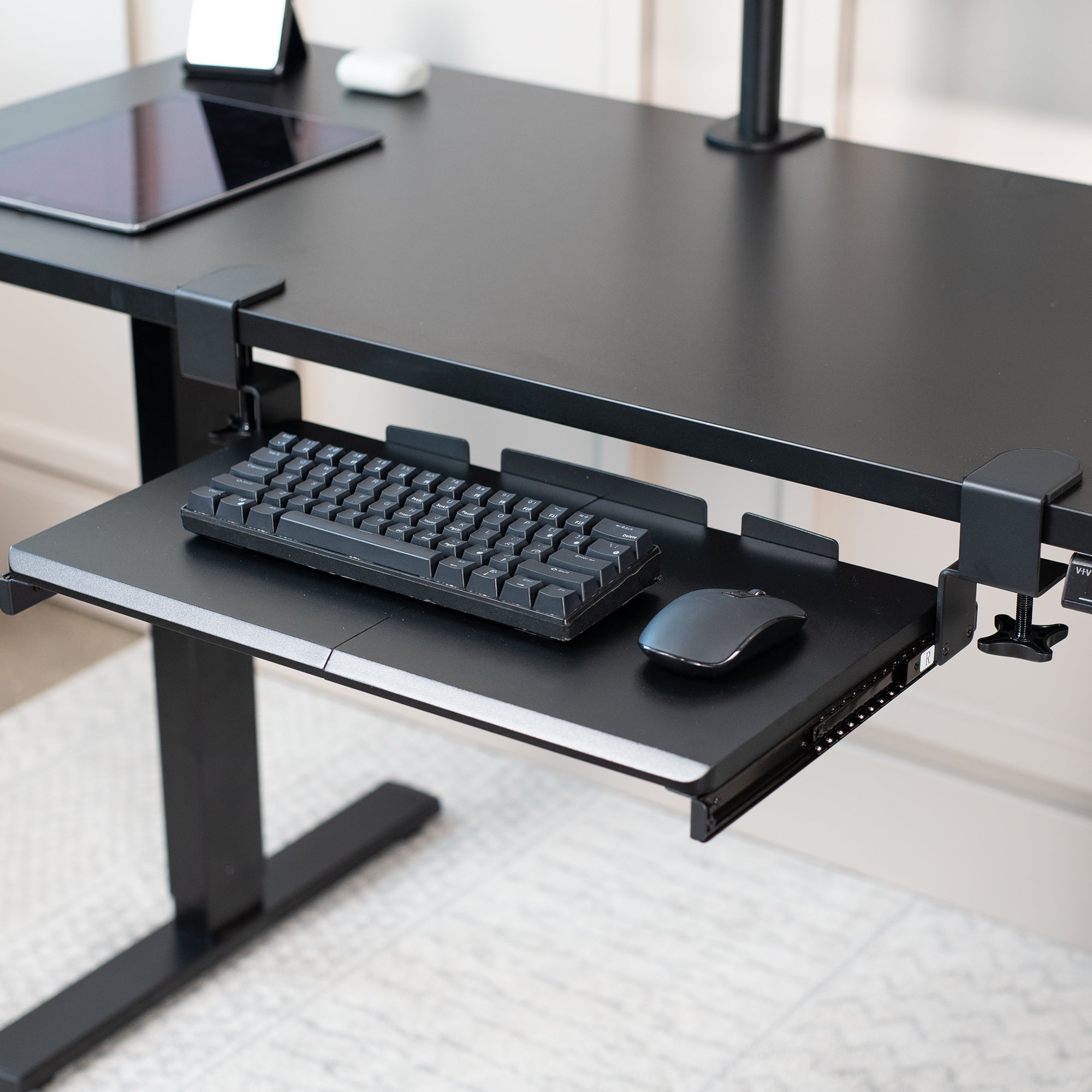 Compact clamp-on pullout keyboard tray.