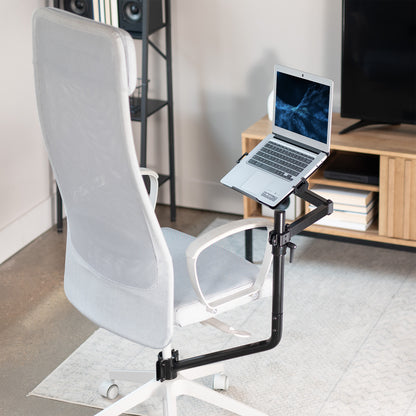 Office chair mounted laptop tray with adjustable extension arm.