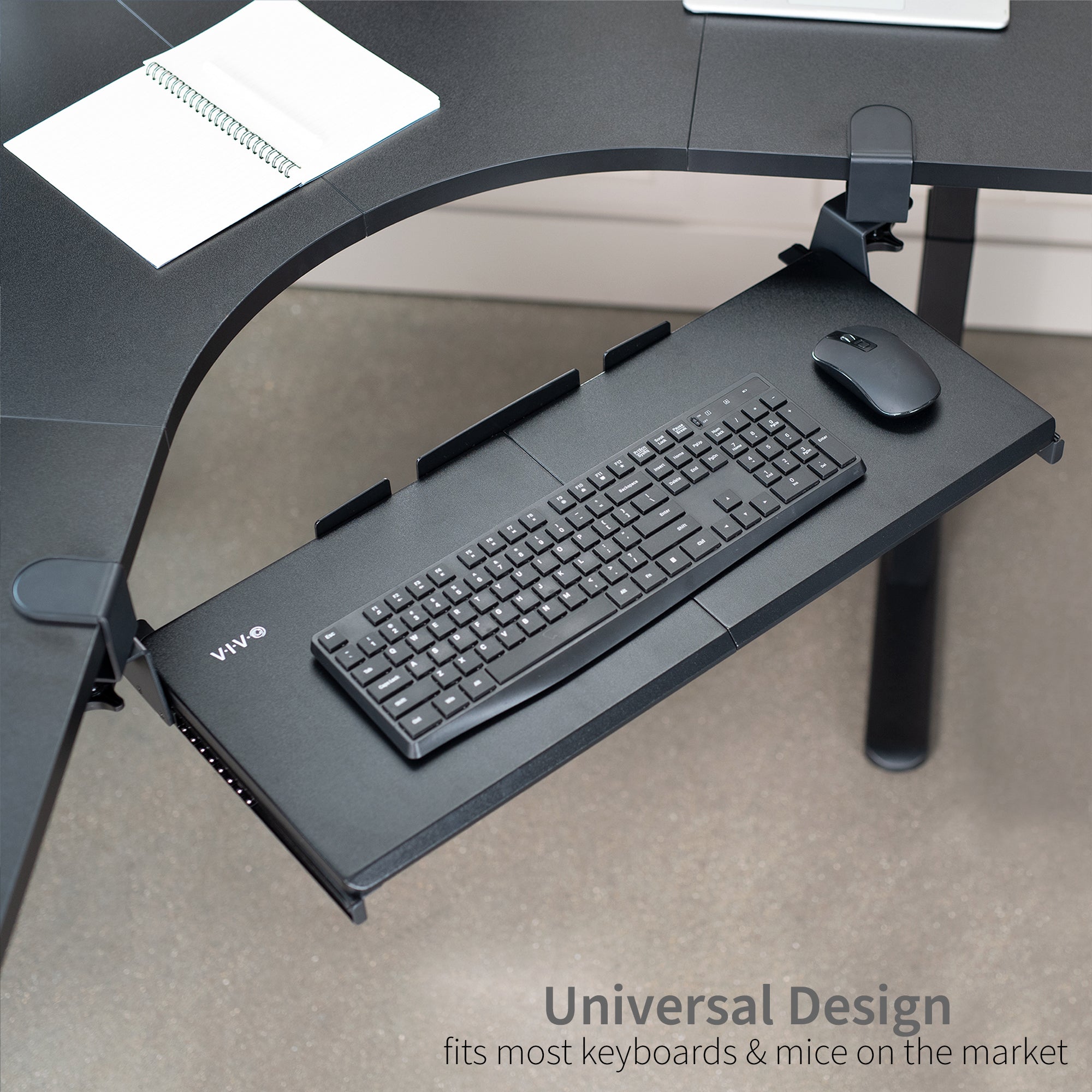 Under desk corner keyboard tray platform with adjustable swivel clamps for an ergonomic workspace.