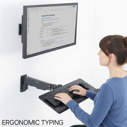 Person using a floating monitor and keyboard setup on a white background