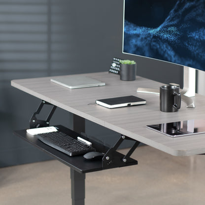 Office workstation desk setup featuring spacious under-desk keyboard tray.