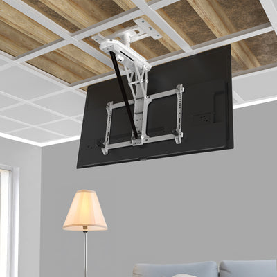 TV mounted on a ceiling mount in a room with a lamp and sofa.