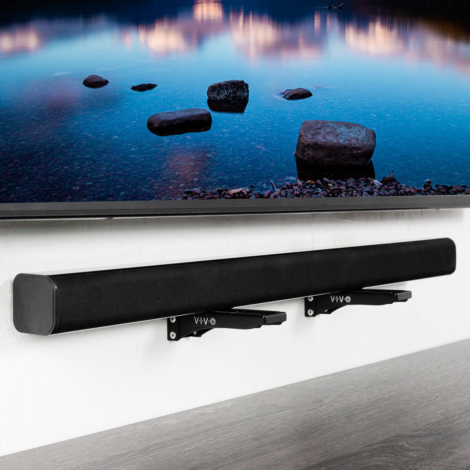 Soundbar brackets attached to the wall for a floating soundbar look.