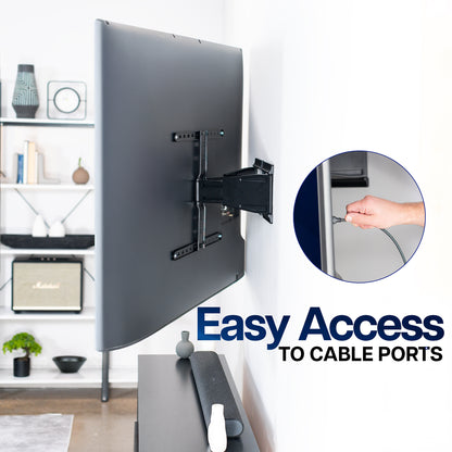 Low Profile Telescoping TV Wall Mount with cable management feature in a living room setting