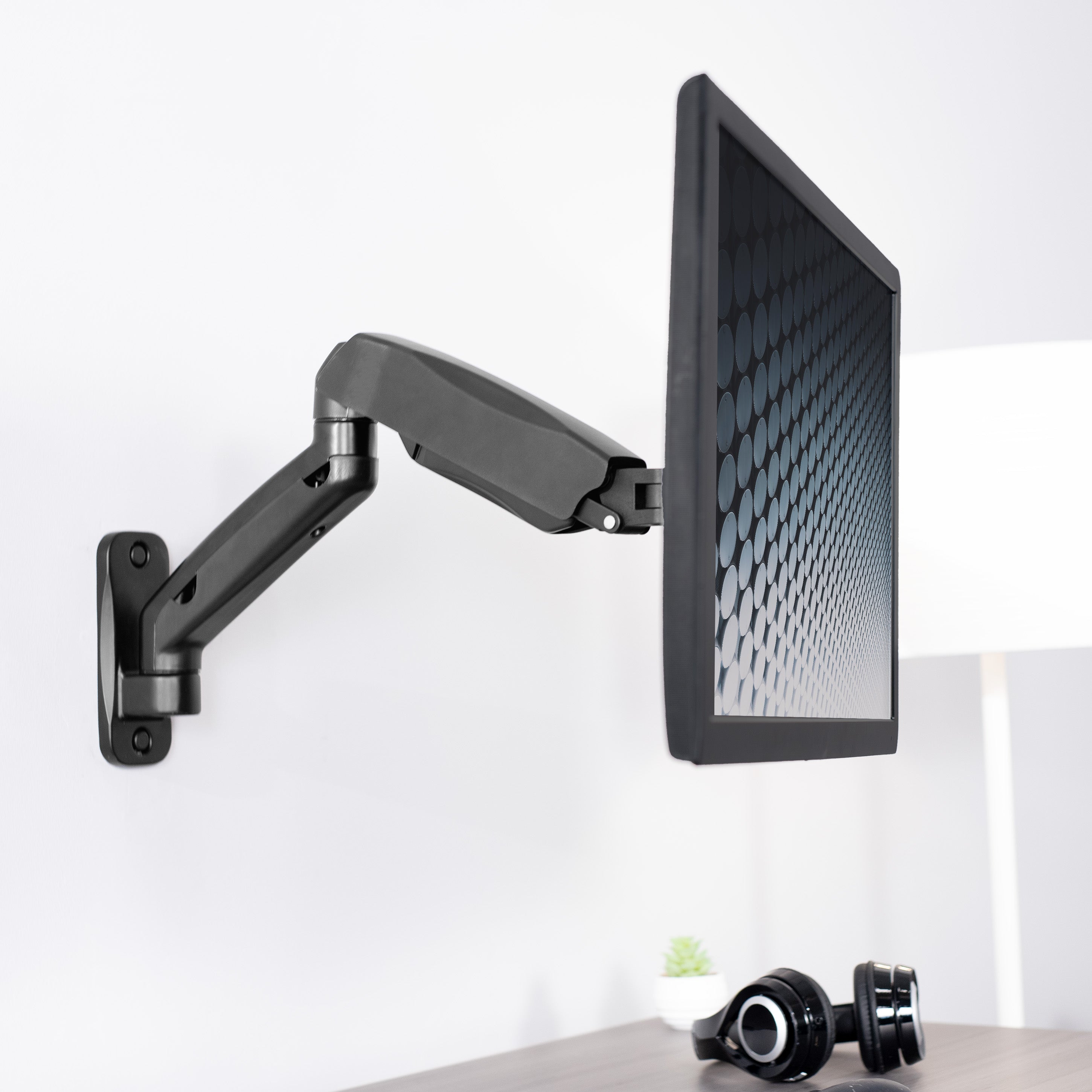 Sturdy adjustable pneumatic arm single monitor ergonomic wall mount for office workstation.