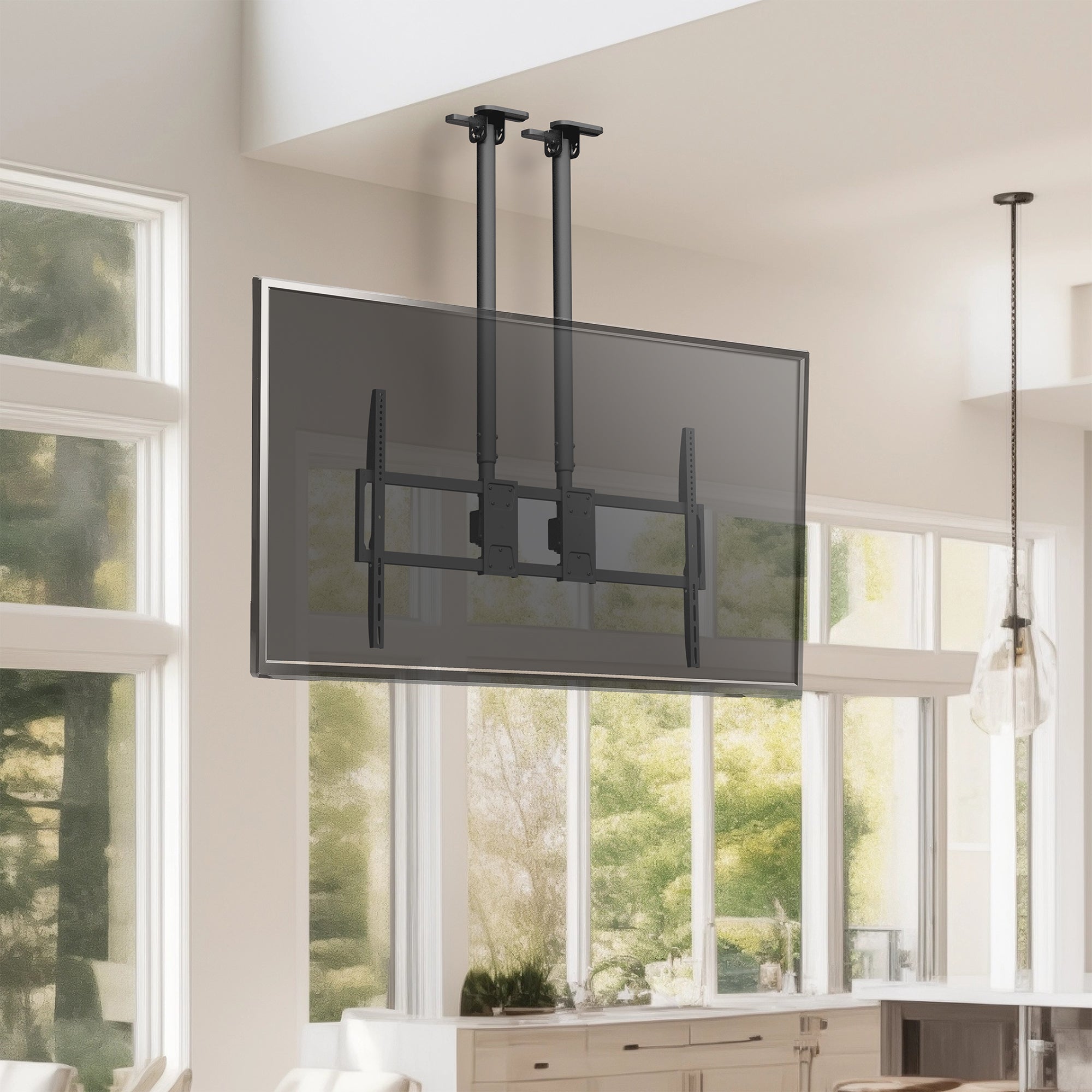 TV mounted on a ceiling mount in a room with large windows