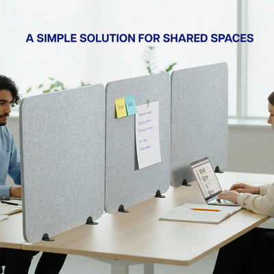 Gray desk privacy panel with people working at a table in an office setting.