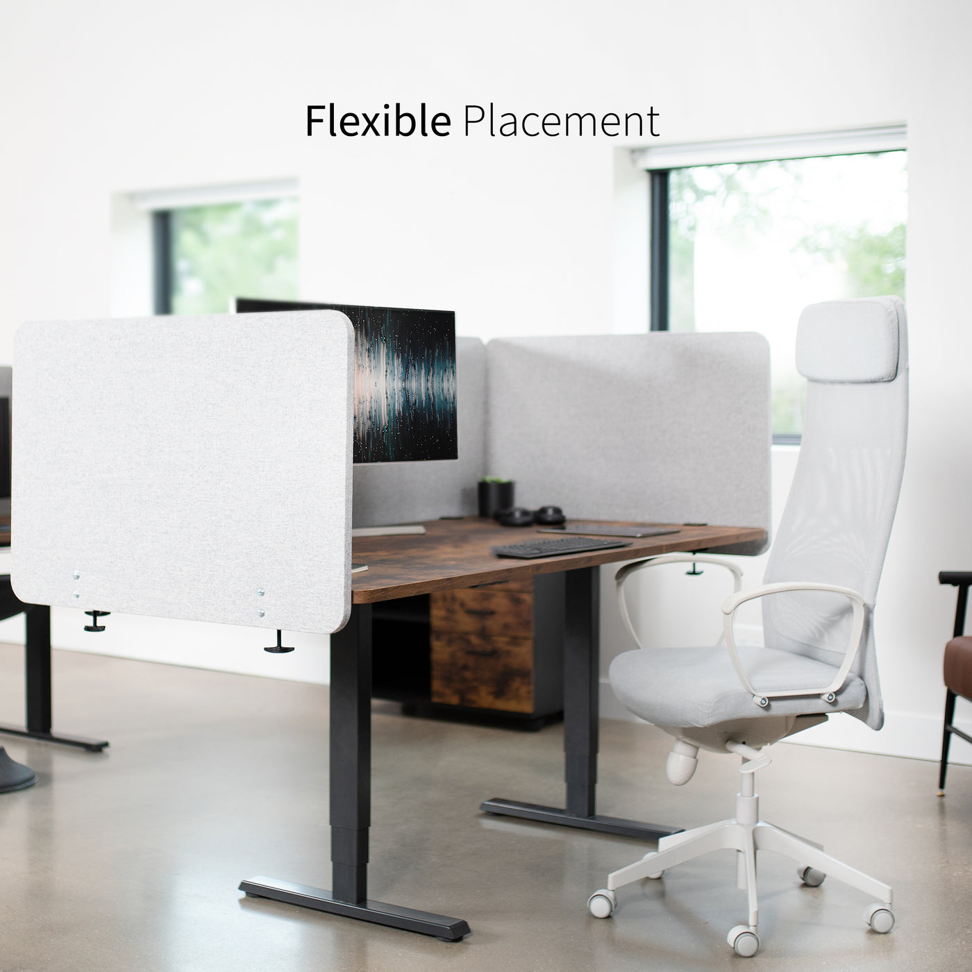 Clamp-on desk privacy panel for office workspace with flexible placement.