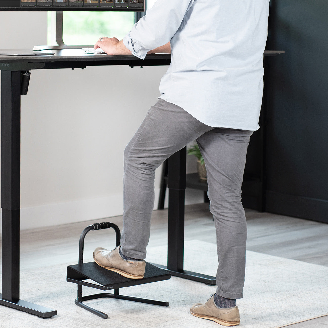 Ergonomic under the desk footrest for sitting or standing desks.