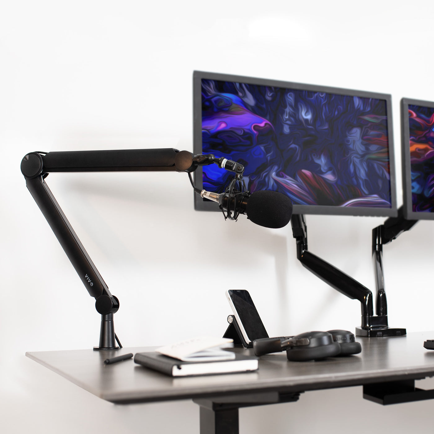 Elevate your mic or boom in your workspace to more comfortably produce content.