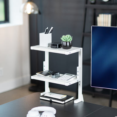 Sleek above desk or below desk clamp-on shelf with two shelves for convenient storage and organization. Lower shelf height adjusts and is removable.