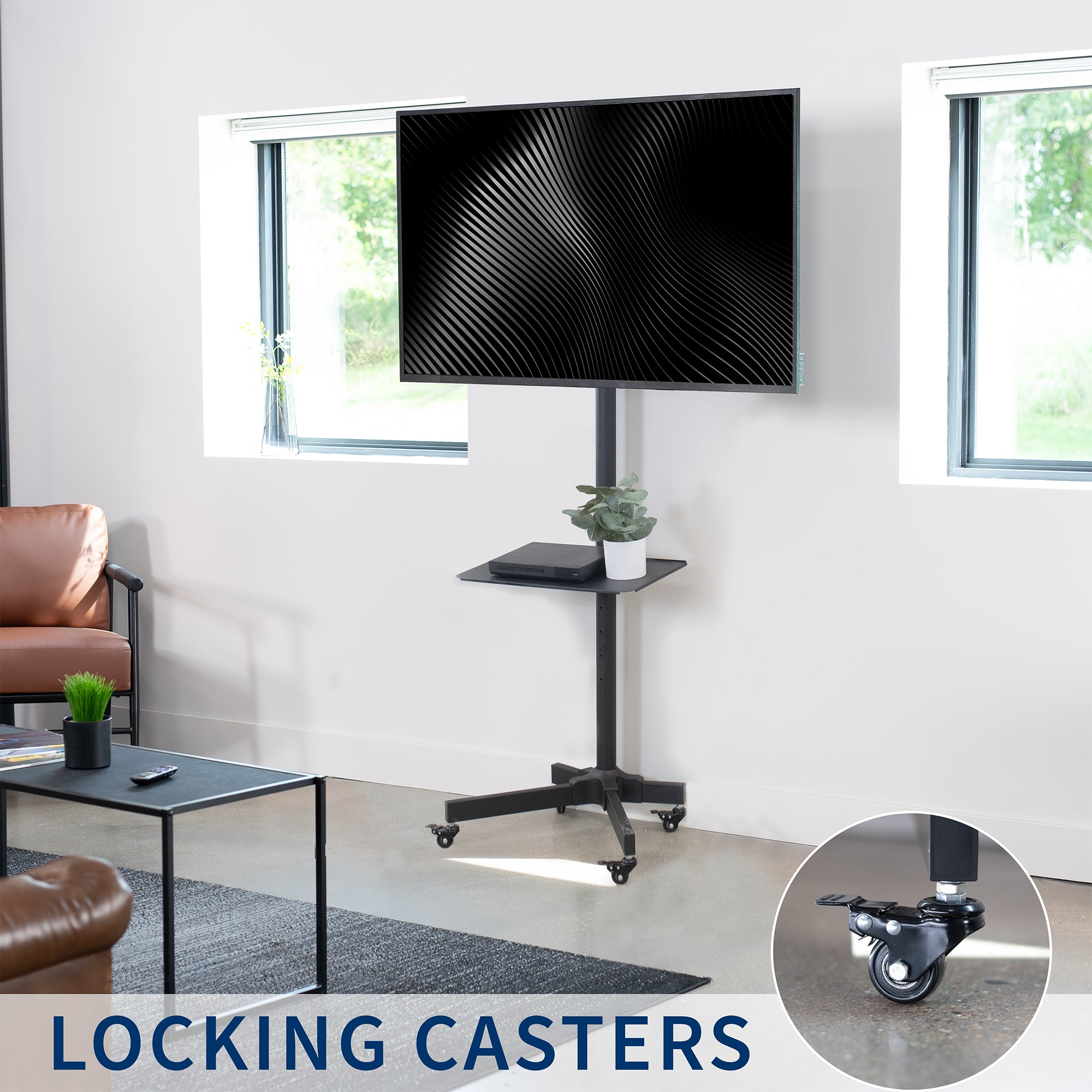 Mobile TV cart displays large screen on rolling stand for ergonomic viewing.