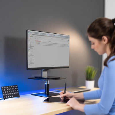 Sturdy desk mount riser for laptop or monitor that provides ergonomic viewing and reduces strain.