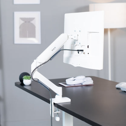 Sturdy clamp-on mechanical arm single monitor desk mount with articulation, height adjustment, and cable management.