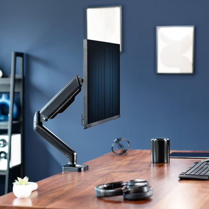 Sturdy clamp-on mechanical arm single monitor desk mount with articulation, height adjustment, and cable management.