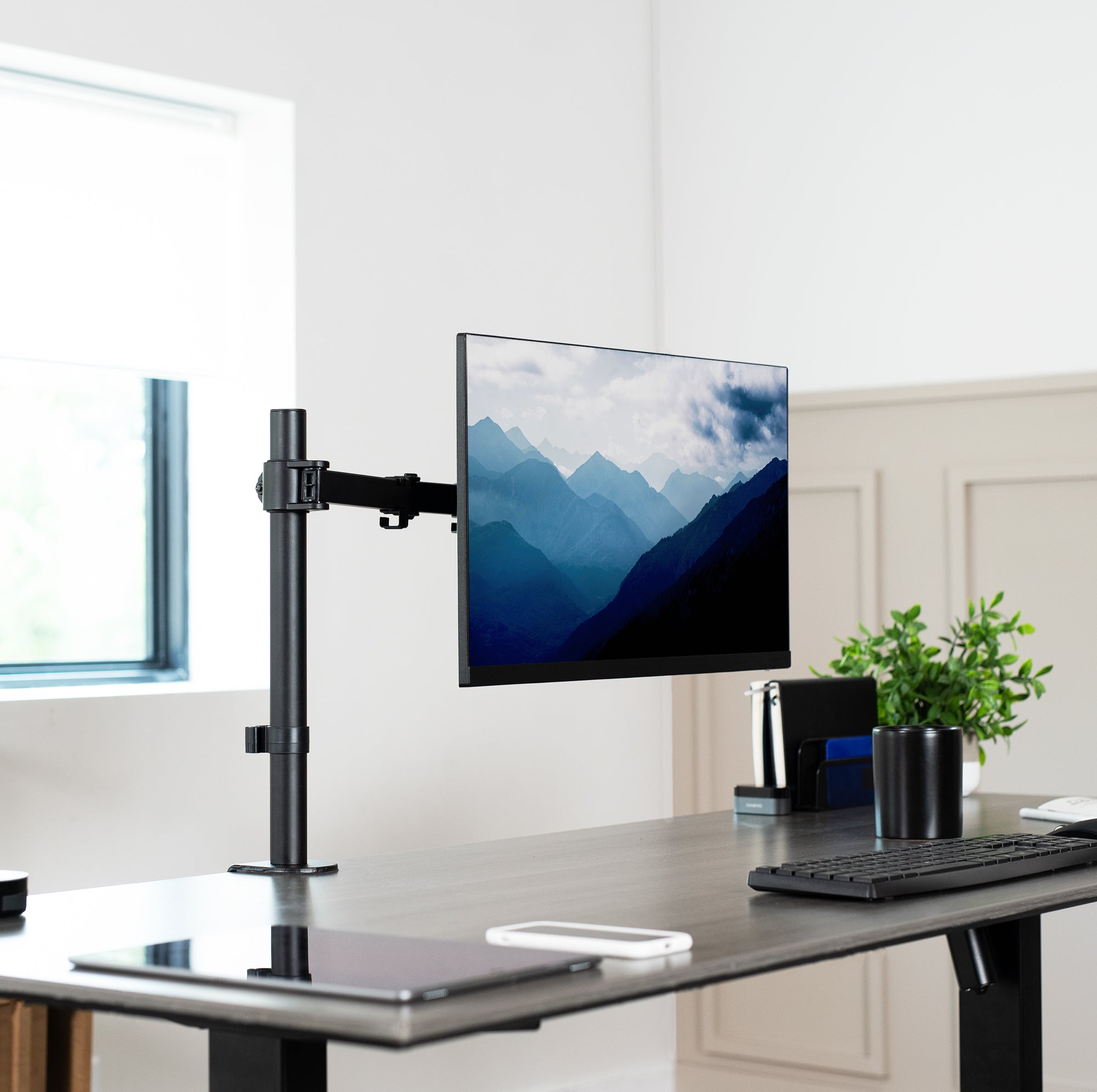 Single monitor desk mount from VIVO with articulation and cable management.