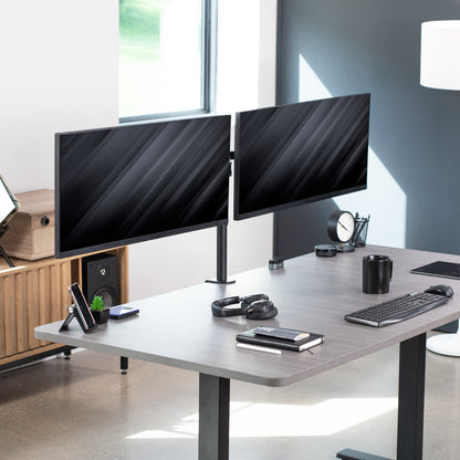 Sturdy adjustable dual monitor ergonomic desk mount for office workstation.