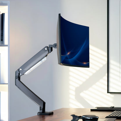 Pneumatic Arm Single Ultrawide Monitor Desk Mount on desk in office space