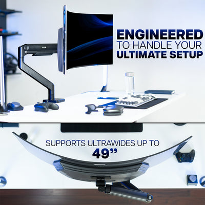 Computer monitor stand with text 'Engineered to handle your ultimate setup' and 'Supports ultrawides up to 49”'.