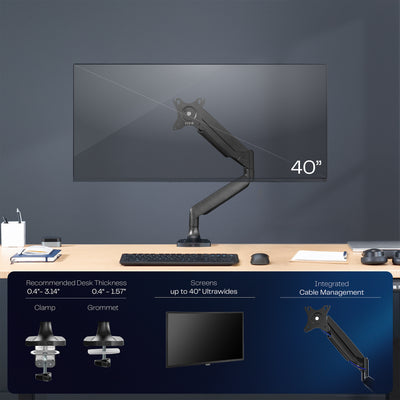 Single ultrawide monitor desk mount arm with a black finish on a dark wall.