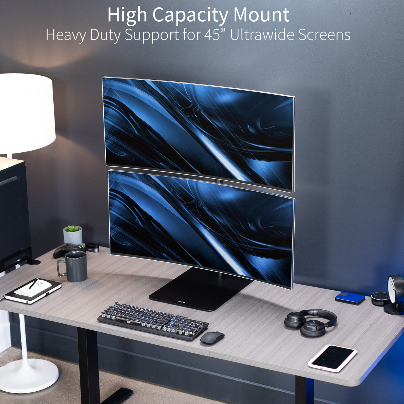 Dual Ultrawide Vertical Monitor Desk Stand elevates 2 large monitors in a vertically stacked array for comfortable viewing angles and efficient use of desk space. The freestanding base provides excellent support with no need to drill or clamp into your desktop.
