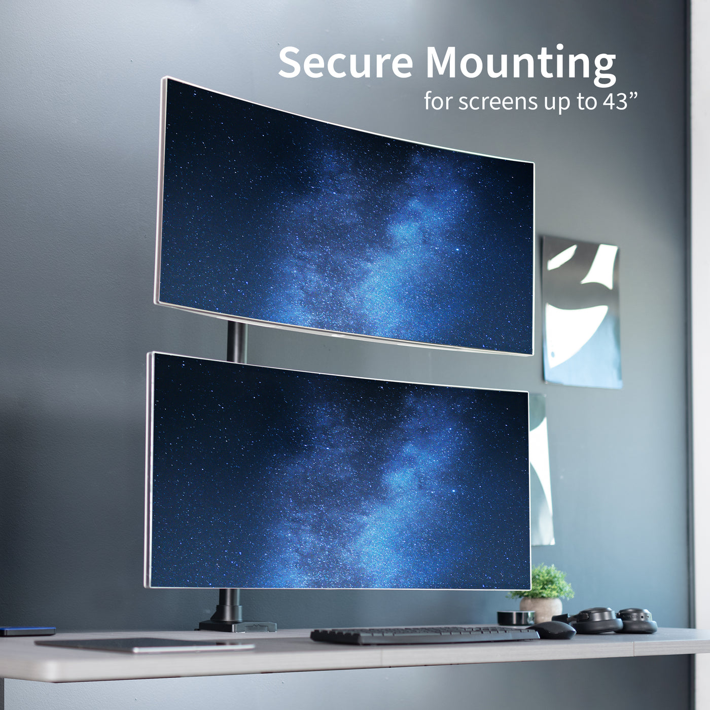 Dual Ultrawide Vertical Monitor Desk Mount in a stacked array elevates 2 large screens to a comfortable viewing angle and saves desk space.