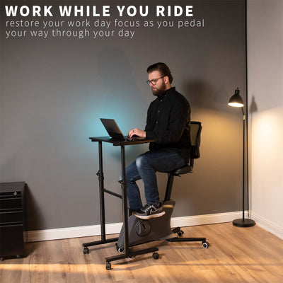 Heavy-duty ergonomic height adjustable stationary exercise bike workstation desktop.