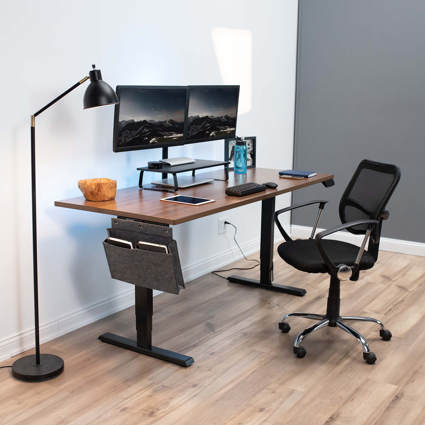 Fully furnished office space and desk setup with a desk-side pocket holder.