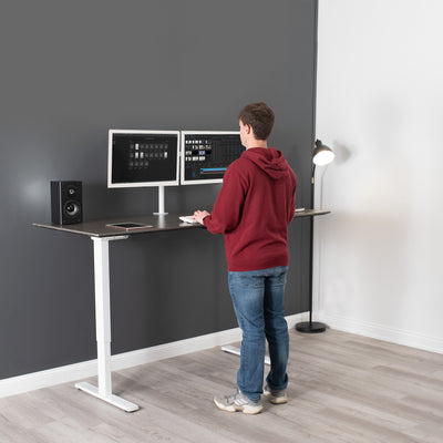 Sturdy ergonomic sit or stand desk frame for active workstation with adjustable height and smart control panel.