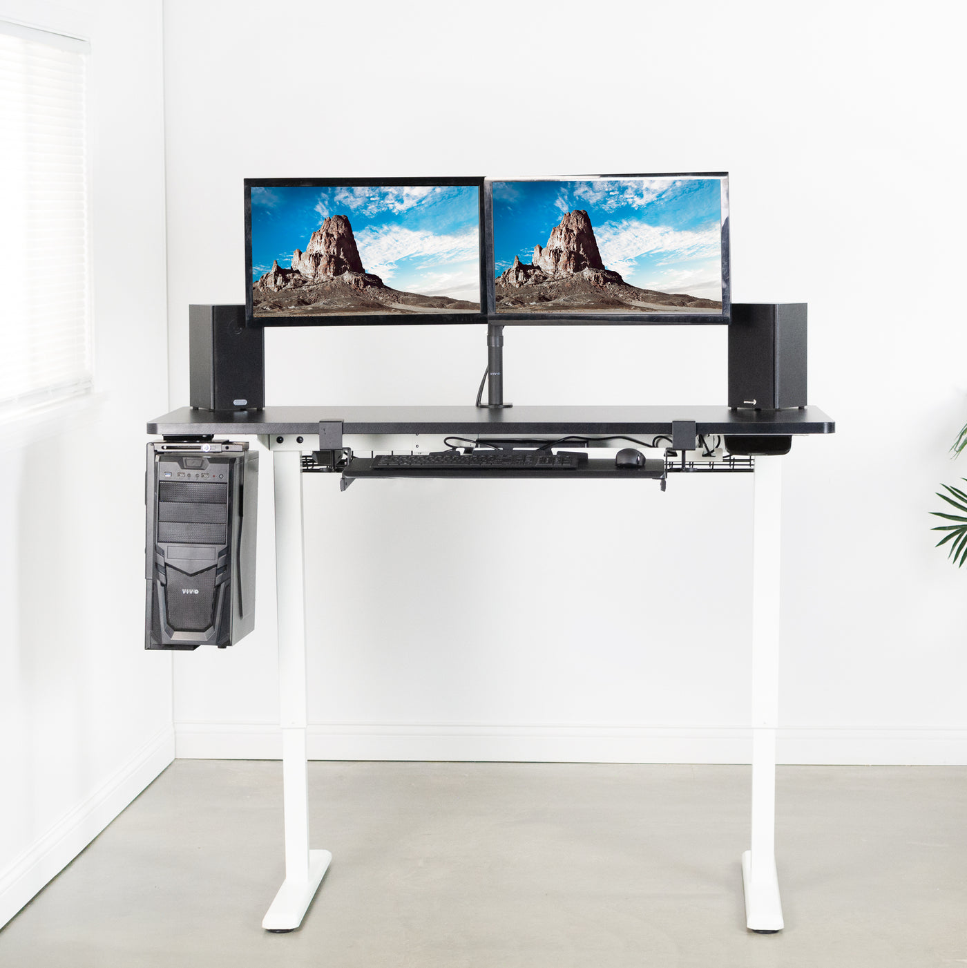 Heavy-duty electric height adjustable desktop workstation for active sit or stand efficient workspace.