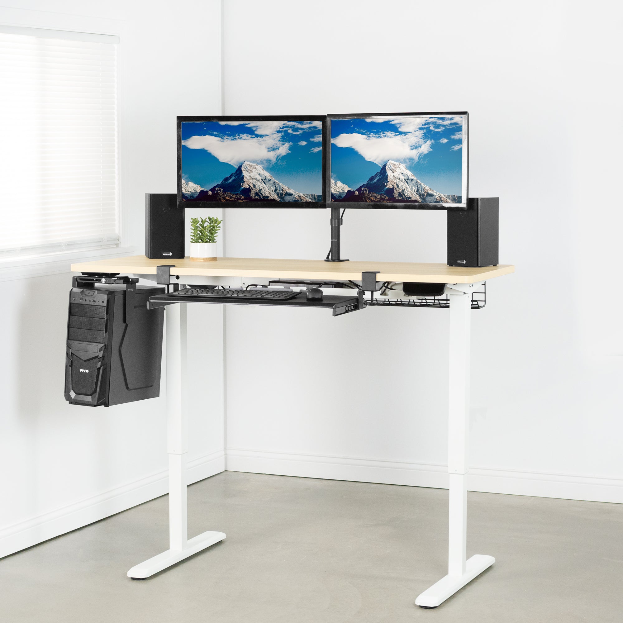 Heavy-duty electric height adjustable desktop workstation for active sit or stand efficient workspace.