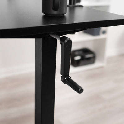 Side manual desk frame adjustment.