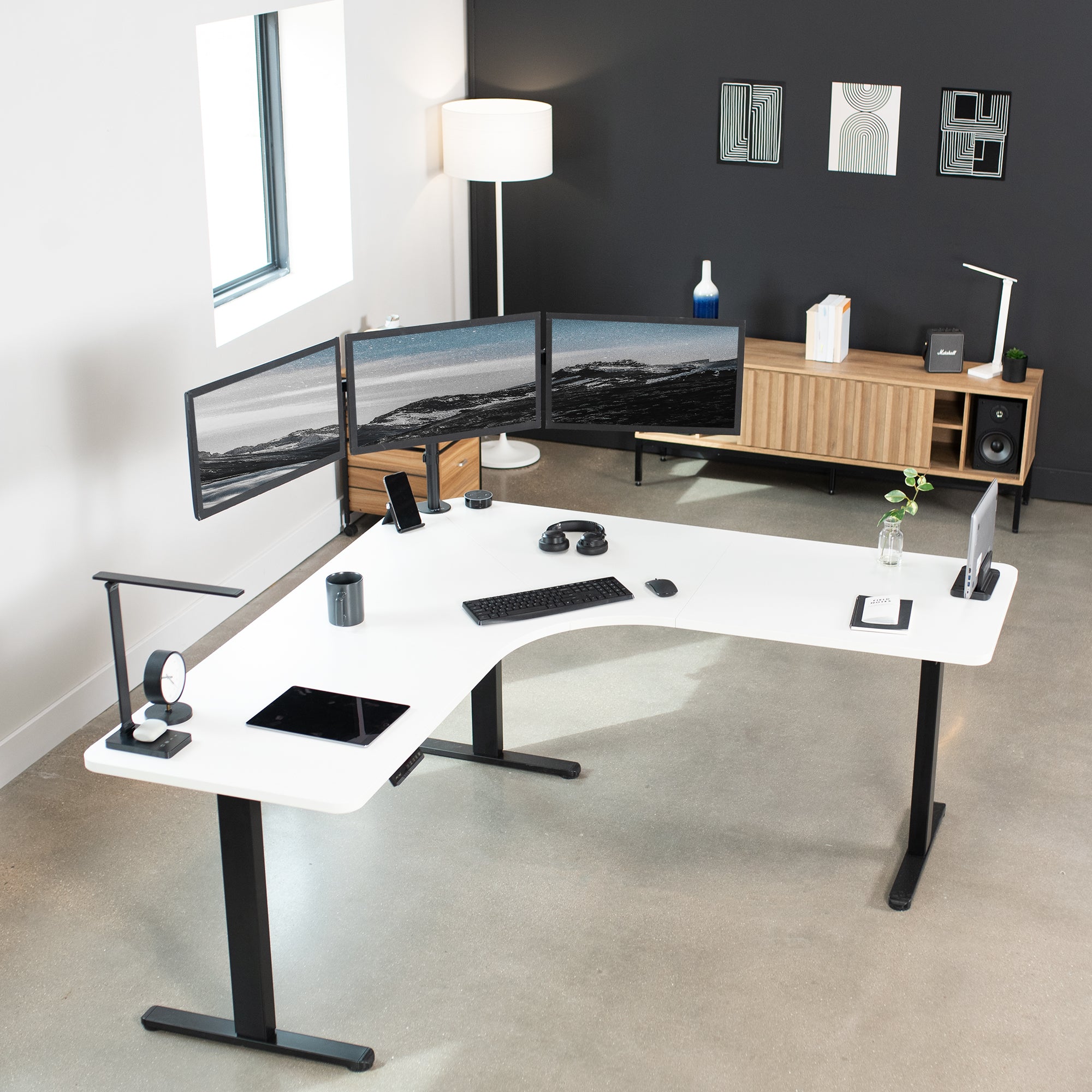 Large heavy-duty electric height adjustable corner desk workstation with programmable memory controller.