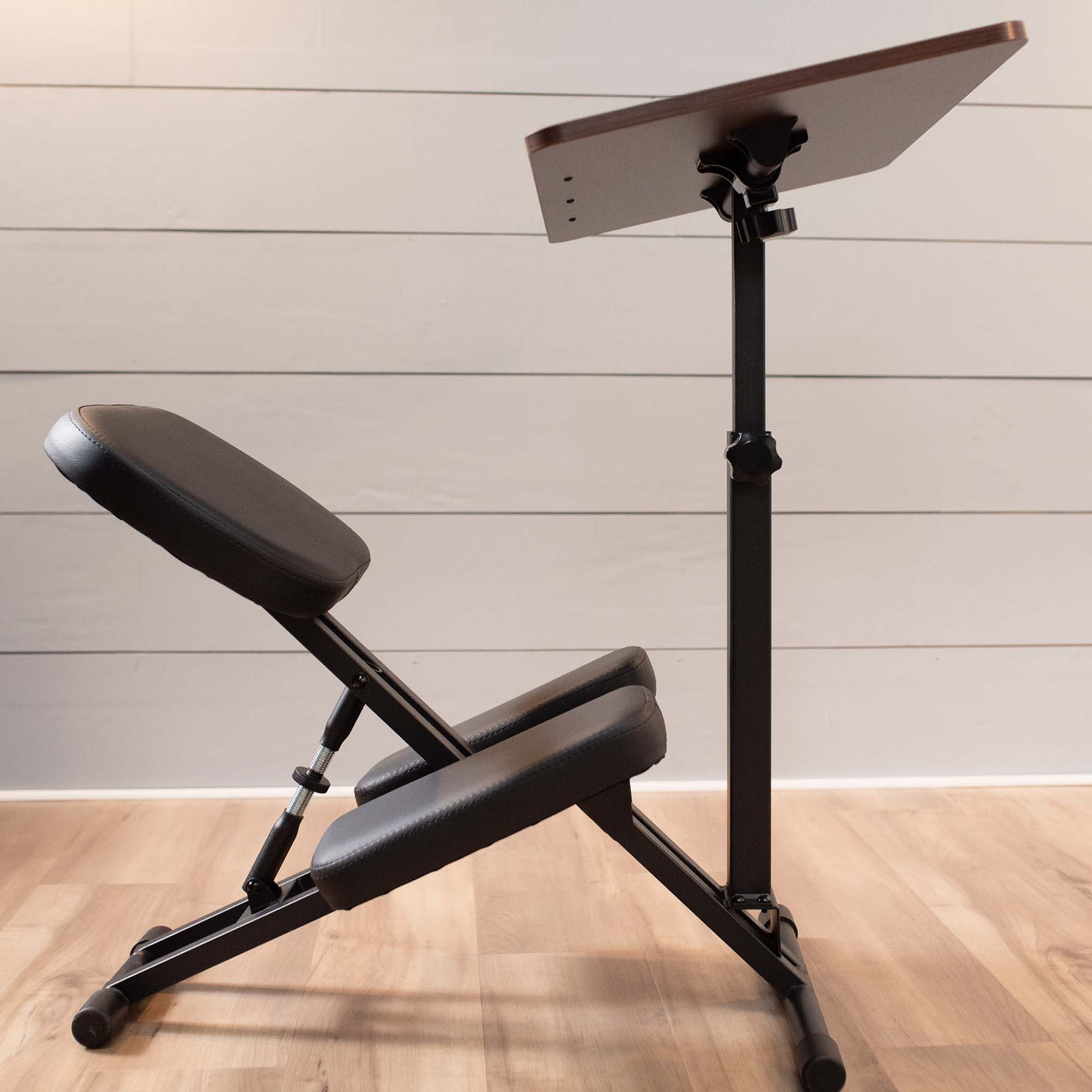 Comfortable kneeling chair desk for tension relief and posture.